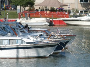 Dozens of boats dock on the Sydenham River as the 25th annual Wallaceburg Antique and Motor Boat Outing (WAMBO) began on Friday night. (David Gough/QMI Agency/david.gough@sunmedia.ca)