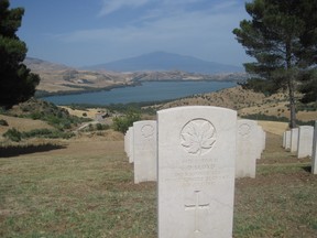 The grave of Pte. Charles Lloyd of the Hastings and Prince Edward Regiment at the Canadian War Cemetery at Agira, where most of the 562 Canadians who died in the Allied conquest of Sicily are buried.
