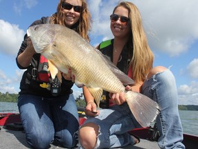 Ashley Rae, left, with Amy McPherson, holding a 32.5-inch sheepshead caught and released on the Bay of Quinte.