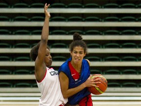 Kia Nurse, right, drives past an opponent at the national senior women's basketball camp Friday at the Saville Community Sports Centre. (David Bloom, Edmonton Sun)