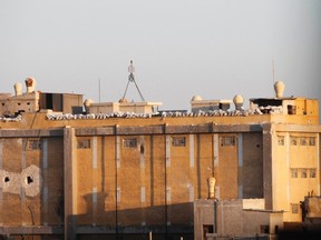 Sandbags are piled on top of a building where forces loyal to Syria's President Bashar al-Assad reside, near Nairab military airport, in Aleppo August 9, 2013. (REUTERS/Nour Kelze)
