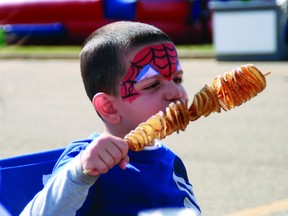 Saleem Karaje, 3, takes a bite out of a chip stick at Transalta’s 2012 InterPlay festival, one of the many family-friendly activities to experience while staying in Fort McMurray. VINCENT MCDERMOTT/TODAY FILE PHOTO