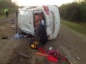 A 31-year-old Edmonton woman is dead and a teenager has serious injuries after a rollover on the Buffalo Lake Metis Settlement in northeastern Alberta. Boyle RCMP say they received a 911 call from a homeowner on the settlement shortly after 5 a.m. Friday when a white Dodge Journey carrying several people rolled over in the middle of a gravel road. (RCMP PHOTO)