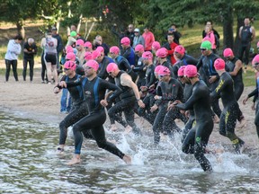 Swimmers take the plunge into the chilly waters of Lake of the Woods to kick off the inaugural Sioux Narrows Paradise Triathlon, at  Sioux Narrows Provincial Park, Saturday, Aug. 10, 2013.
REG CLAYTON/Daily Miner and News
