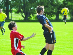 Ryan Wiebe of Portage United knocks down a ball during the Portage/Stonewall United game Aug. 10. (Kevin Hirschfield/THE GRAPHIC/QMI AGENCY)