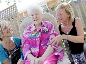 Norah Stoner, centre, was surrounded by family on Saturday August 10, 2013, for her 100th birthday celebration. Jackie Rowe, left, and Carolee Milliner, right, are two of Stoner's 20 grandchildren. KIRK DICKINSON/FOR CHATHAM DAILY NEWS/ QMI AGENCY