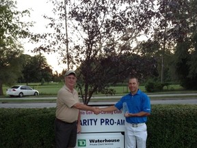 Tournament Chairman Bruce Davie congratulates Brian Hadley, winner of the Sarnia Golf and Curling Club Pro Am Saturday.  SUBMITTED PHOTO.