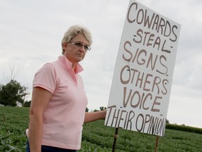 Judy Park of Tupperville recently placed a new sign near her house that voices her opinion on the theft of four anti-wind turbine signs from her private property in late July. KIRK DICKINSON/FOR CHATHAM DAILY NEWS/ QMI AGENCY