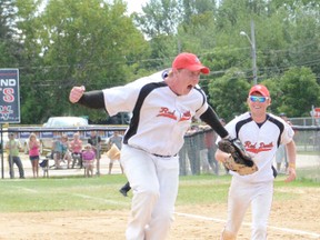 Wiarton pitcher Michael Lagace-Roote jumps in celebration as first baseman Ty Sebastian looks on as the Red Devils beat the Napanee Express 10-2 on Sunday to win the 2013 Canadian Junior Men's Fastball Championship at Duncan McLellan Park.