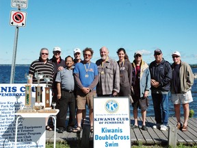 Members for the Kiwanis Club of Pembroke come out to support the individuals who completed the Double Cross Swim. The three people who swam, or will swim soon are (left to right with the medals) Chris Sanzo, Bob McLaughlin and Witney Underhill.