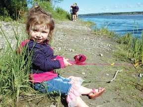 Kianda Boudreau sits and waits for some fish to swim by at this year's Kinsmen Fishing Derby.
