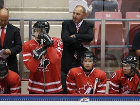 Canada head coach Brent Sutter handles bench duties during a game against Team Finland during the 2013 USA Hockey Junior Evaluation Camp at the Lake Placid Olympic Center on August 7, 2013 in Lake Placid, New York.  (Bruce Bennett/Getty Images/AFP)