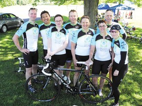 The Flouriders team — sponsored by an Ottawa dentist — pause for a group photo before grabbing lunch at Farran’s Park in Ingleside during the 2013 MS Bike Tour on Saturday.
Staff photo/CHERYL BRINK