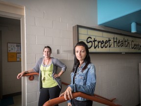 Justine McIsaac, right, an outreach worker responsible for distributing needles and other injection supplies, and Violet Acevedo, the operations co-ordinator, stand outside the Street Health Centre, a location funded by Kingston Community Health Centres. (Sam Koebrich For The Whig-Standard)