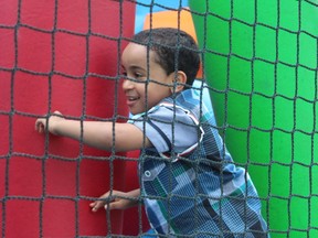 A young member of Fort McMurray’s Muslim community celebrates the end of Ramadan in a jumping castle. On Sunday, organizers held a carnival featuring a BBQ, petting zoo, henna tattoos, laser tag, pony rides and several jumping castles. VINCENT McDERMOTT/TODAY STAFF