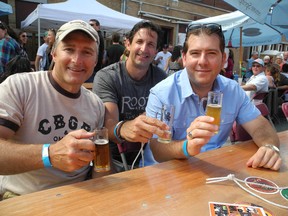 Friends Brian Bouzane, left, Pat Chartier, centre, and Sean Pretty were among the close to 1,000 people who turned out for the first Elgin Street Craft Beer Festival Saturday. HAROLD CARMICHAEL/SUDBURY STAR/QMI AGENCY