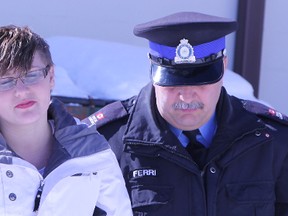 Aleisha Block, as she was being escorted into a Timmins court last March. Block will return to court on August 23 to face charges of violating her bail. She is accused of second degree murder. Timmins Times LOCAL NEWS photo by Len Gillis.