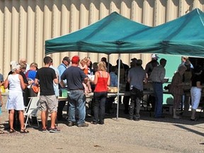 A large lineup formed at the annual Milo Lions barbecue on Sunday, Aug. 11. Enough food was prepared for about 350 people -- that's more than triple the village's population of 100.