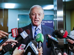 Outgoing Deputy Mayor Doug Holyday talks to reporters at City Hall on Monday. (ERNEST DOROSZUK, Toronto Sun)