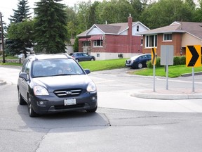 A car manouvres around a traffic calming device on Southview Drive in Sudbury's South End on Monday evening.
GINO DONATO/THE SUDBURY STAR