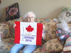 Margaret Humphrey of Kincardine has created a rug hooking piece to be sent to the 2015 Pan Am Games in Toronto. She presents the finished project on Aug. 7, 2013 at her home which is full of her work, including the two pieces on the wall. (ALANNA RICE/KINCARDINE NEWS)