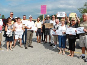 Huronville residents peacefully protested outside the Kincardine Municipal building on Aug. 7, 2013 before the general council meeting to show their support for lowered water rates.