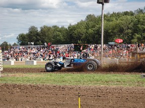 A car zips down the track in the mud drag races at this year's Ranch Lake Pull.