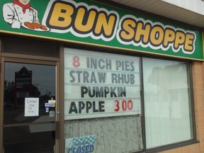 A sign on the Bun Shoppe Bakery on Tuesday notes it is still closed due to fire