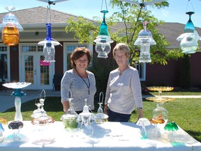 The Inverlyn Lake Estates Creative Arts and Crafters Show took place on Aug. 10 where numerous artists and crafters alike showed their work. Cindy Ernewein, who created the class bird feeders, and Marilyn Ryan, who makes the glass solar lights, displayed their work at the sale. (ALANNA RICE/KINCARDINE NEWS)