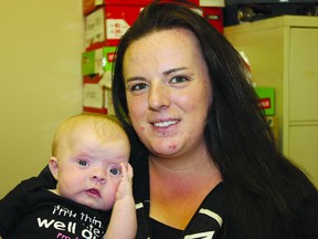 Justine Shantz holds her daughter, Jolene Fuder. Jolene was born with an incompletely formed skull, and a $64,000 test is needed to confirm a diagnosis of hypophosphatasia. Shantz is raising money to cover the out-of-province test.