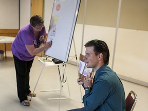 Pasha Hansen, 46, draws characters from “Green Pea: Not a Home For Me” while her son Chance, 19, reads to a group of children and parents. The Whitecourt and District Public Library invited Chance and Pasha to read at the Central School for the summer reading program.
Christopher King | Whitecourt Star