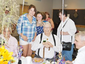 Alex McCallum’s great-grandchildren, Brea Udholm, left, 15, and Dahlia Bownes, 11 and were on hand to wish him a happy 90th birthday on Saturday, Aug. 10.