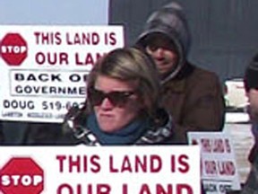 Members of the Ontario Landowners Association during a 2011 protest in Lambton County, near Watford. The organization is not welcome at another Sarnia Canada Day parade if it displays a sign that says Back Off Government.