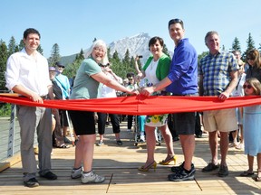 Mayor Karen Sorensen is joined by Councillors Stavros Karlos, Leslie Taylor, Grant Canning, and Brian Standish in cutting the ribbon during opening of the pedestrian bridge on Tuesday, July 2. CORRIE DIMANNO/CRAG & CANYON/QMI AGENCY