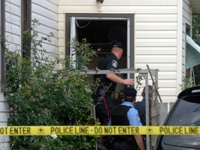 A Woodstock police officer forced open a door at a Huron Street home during the investigation of a "suspicious death" on Tuesday evening.
