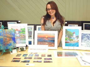 Artful Hands hosted the annual art show and sale in the Davidson Centre for the first time on Aug. 10, 2013. Sarah Chisholm showcases her photography which focuses on Kincardine sights. (ALANNA RICE/KINCARDINE NEWS)