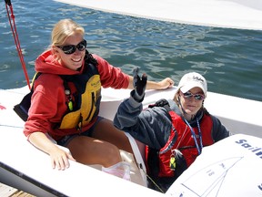 Brighton's Claire Adams is joined by her coach Vanessa Watts after capturing the Ontario Martin 16 (Silver Fleet) championship at the John Farrell Regatta last weekend in Hamilton.