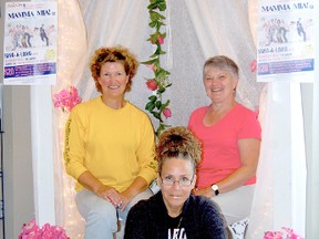 Daniele Alcinii/R-G
Wanda Laurin (left), Sherry Hilton (centre) and Sue Packer pose beneath a makeshift Mama Mia! display within River City Cinemas. St. Jamesí Cathedral Arts Council is set to host a special screening of the film for one night only.