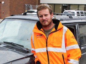 Andy Anderson strikes a pose next to his work truck. Despite his hectic work schedule, Anderson has been a volunteer mentor with Big Brothers Big Sisters for four years, and always makes time for his Little. CLARIE THEOBALD/Edmonton Examiner