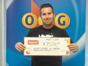 William Nickels with his winning cheque at the OLG Prize Centre in Toronto.