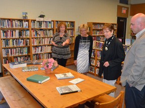 Hepworth library supervisor Bonnie McGann, left, talks to Bruce County Public Library assistant director Kathy Samson, board trustee Lynn Sawatsky and board chairman Mitch Twolan about the branch during a tour of it in August. (Rob Gowan The Sun Times)