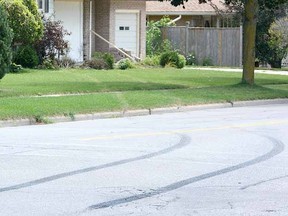 Tire burnout marks lead from an intersection on McCarthy Rd. along Graff Ave. and into the front entrance of a nearby residence. (SCOTT WISHART The Beacon Herald)