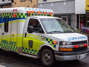 Frontenac Paramedic Service ambulance makes its way through the streets of downtown Kingston.