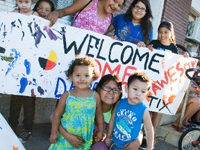 A group of 15 family and friends came to the train station to welcome Myran home on Tuesday. Back left to right: Jesse Beaulieu, Nora Campbell, Marie Myran, Emily Beaulieu and Kaitlynn Smoke. Front left to right: Mary Mousseau, Lily Mousseau and Arthur Roulette. (Svjetlana Mlinarevic/Portage Daily Graphic/QMI Agency)