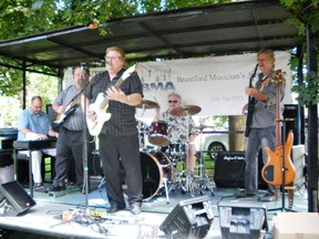 Mike Stoneman (left), Paul Newell, Garry Munn, Bill Isherwood and Bill Koluk entertain in Victoria Park. (Glen Silverthorn, for The Expositor)