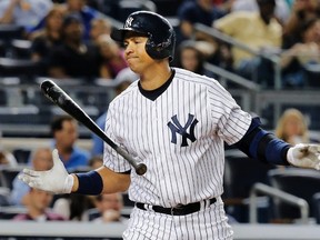 New York Yankees batter Alex Rodriguez reacts as he strikes out against the Los Angeles Angels during American League action at Yankee Stadium in New York, August 13, 2013. (REUTERS/Ray Stubblebine)