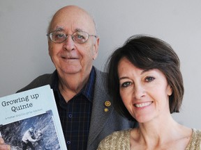 Jack Evans and his daughter, Cyndi Crowder, display the book they wrote together, Growing Up Quinte.