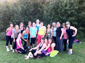 The Zumba in the Park class pauses from their dance routine for a quick photo. - Photo Supplied