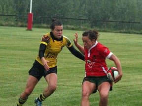 The Strathcona Druids Premier Division women’s rugby team followed up a rain-soaked win over the first-place Calgary Hornets (above) with a 76-5 win over Lethbridge to head into the provincial playdowns on a three-game winning streak. Photo by Shane Jones/Sherwood Park News/QMI Agency