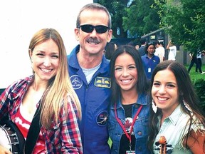 Astronaut Chris Hadfield joins, from left, Trent Severn's Dayna Manning, Emm Gryner and Laura C. Bates for a photo during Canada Day celebrations in Ottawa earlier this year. Trent Severn will perform Sept. 6 at Sarnia's Imperial Theatre. (CONTRIBUTED PHOTO)